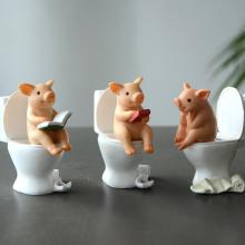 Cute Pig sitting on toilet resin figure